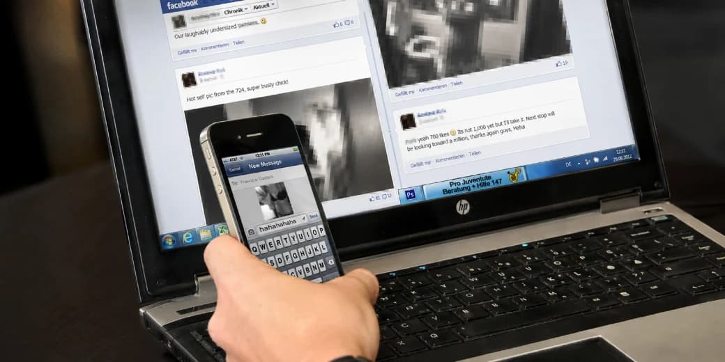 Pixelated intimate images displayed on social media with a phone in the foreground.