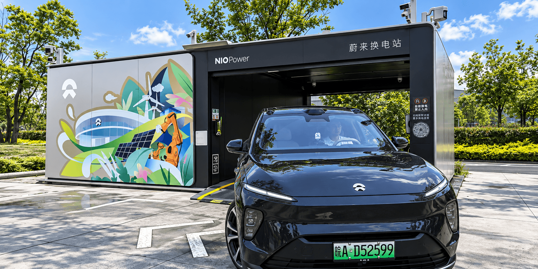 A black NIO electric SUV parked in front of a NIO Power battery swapping station.