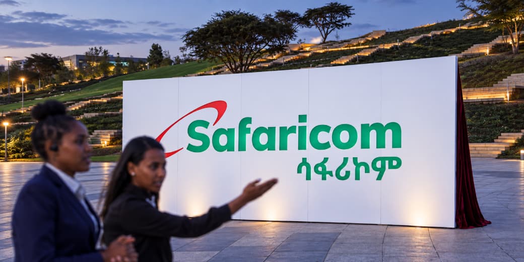 Ethiopian personnel from the Prime Minister's office walk past a billboard during the Safaricom ceremony to officially launch its operations in Ethiopia, in Addis Ababa, Ethiopia, October 6, 2022.