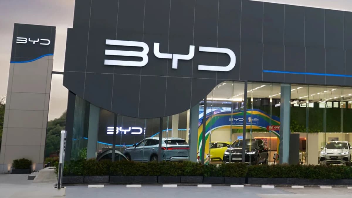 Independent battery test data facing regulatory scrutiny beside a BYD-style battery pack.