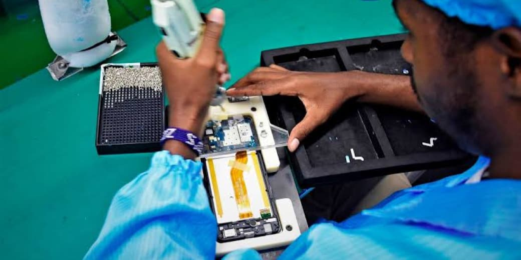 A worker assembling a smartphone on a production line. Credit: Billy Ogada | Nation Media Group.