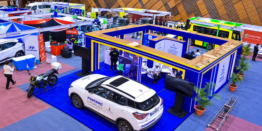 Electric vehicles, motorcycles, buses and exhibitor stands inside Nairobi E-Mobility Week at KICC.