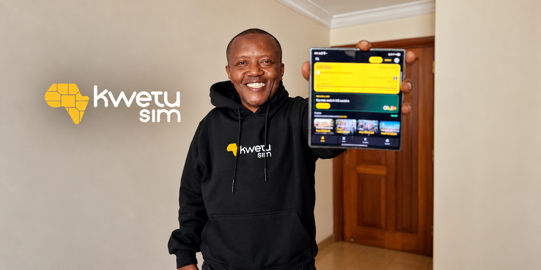A Kwetu eSIM representative holding a mobile device beside the company's logo.